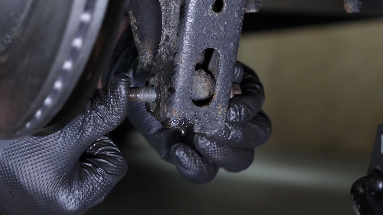 Unscrew the shock absorber foot