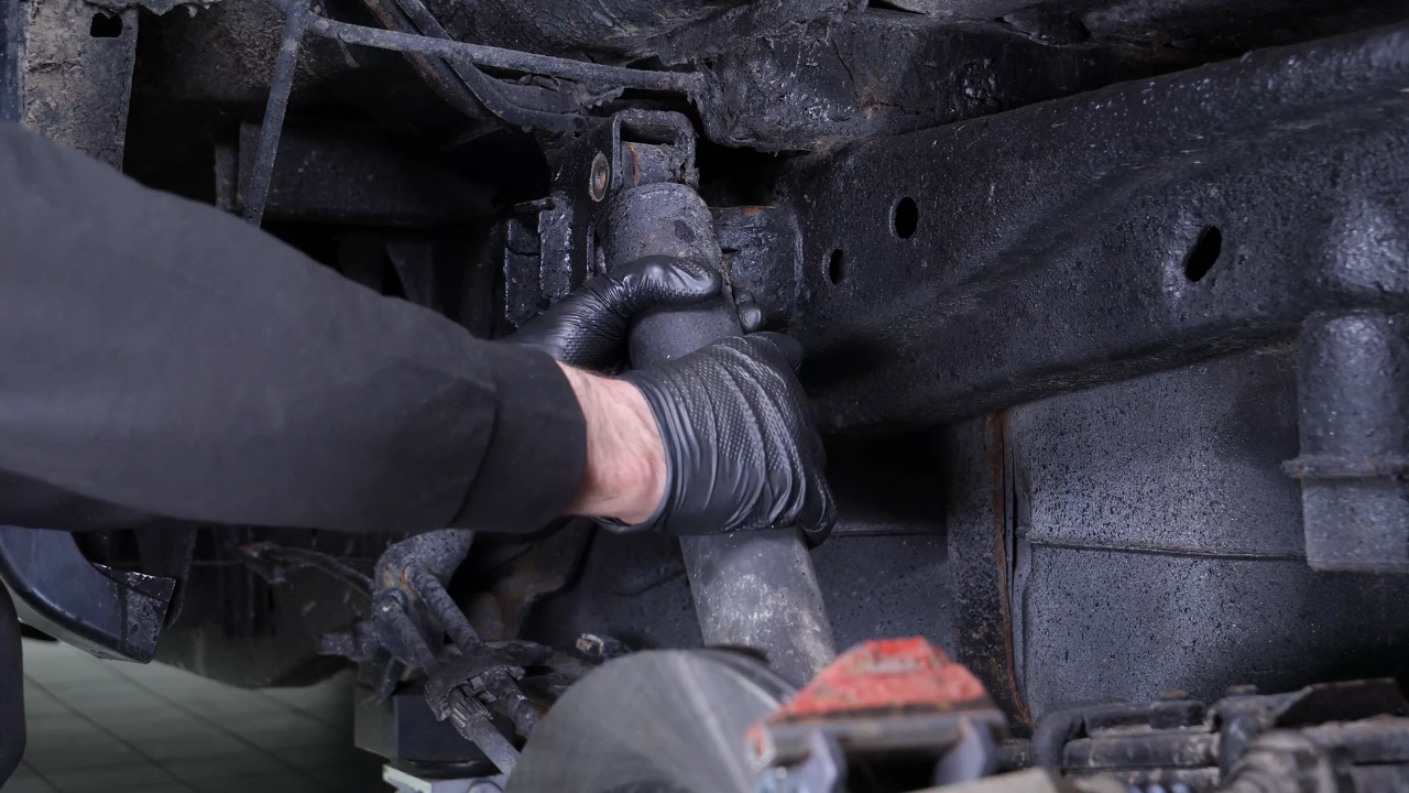 Unscrew the shock absorber foot