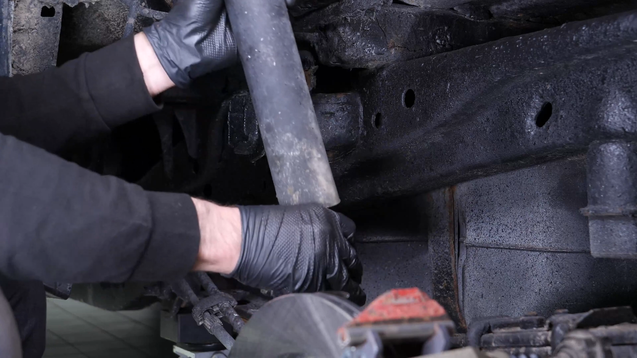 Unscrew the shock absorber foot