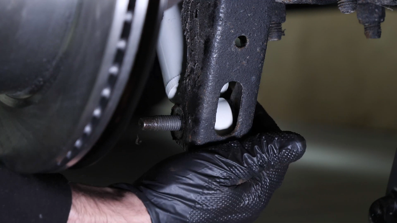 Install the new shock absorber