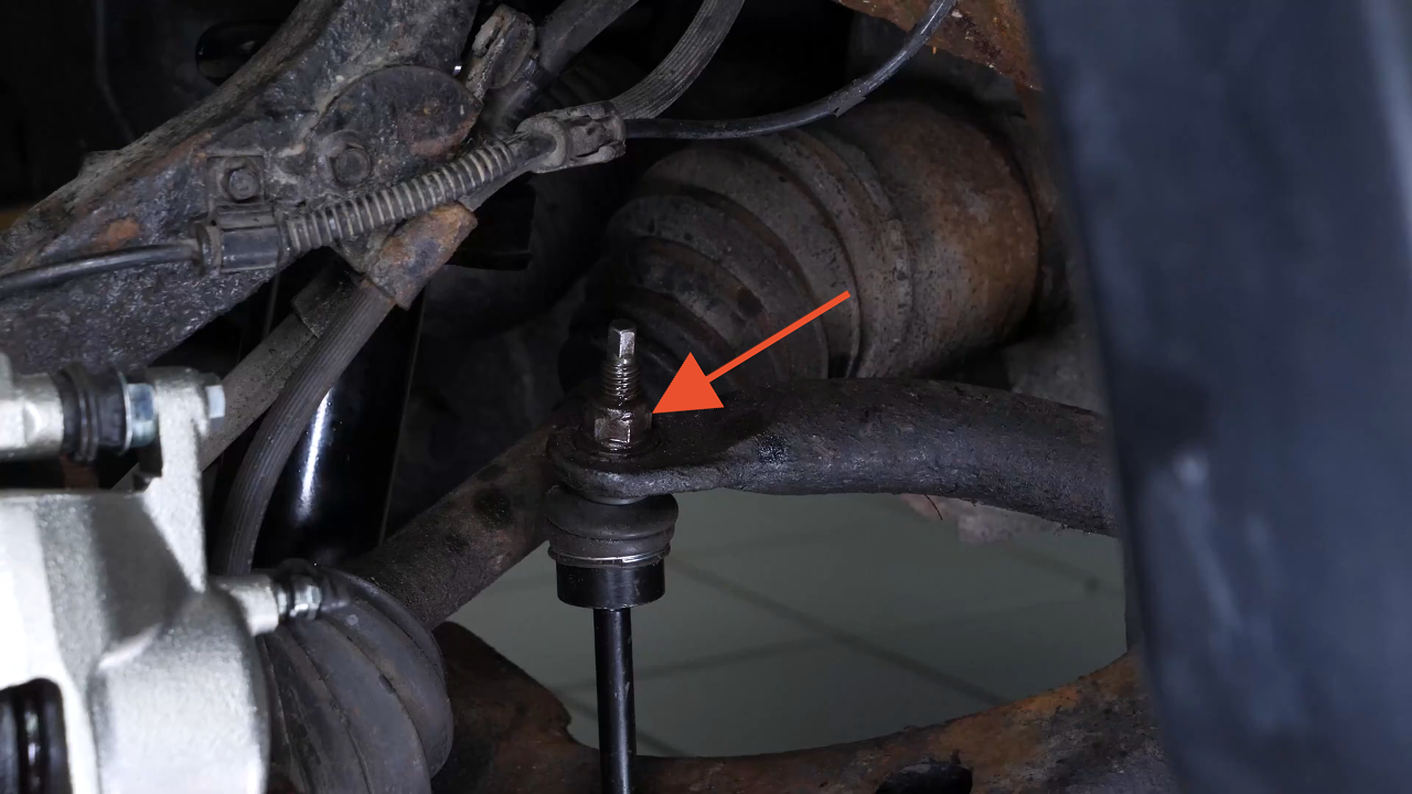 Unscrew the upper ball joint