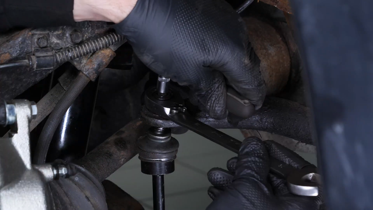 Unscrew the upper ball joint