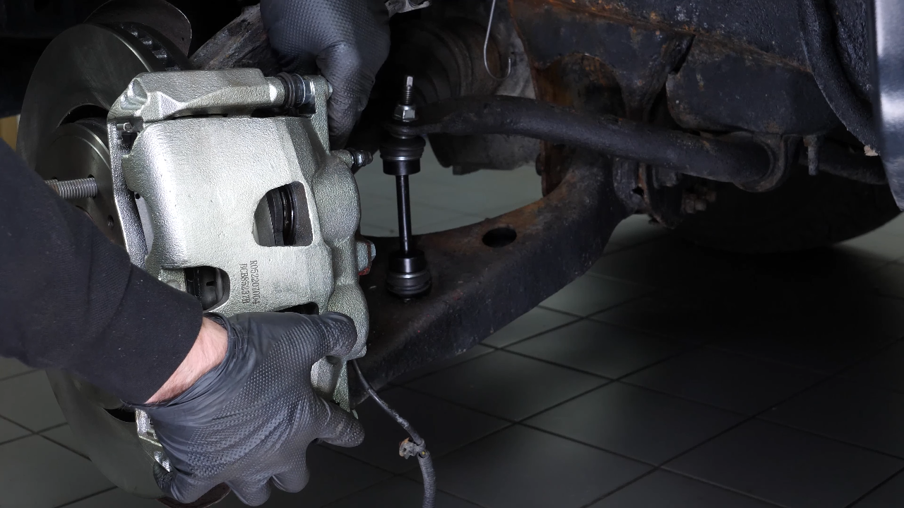 Remove the caliper assembly