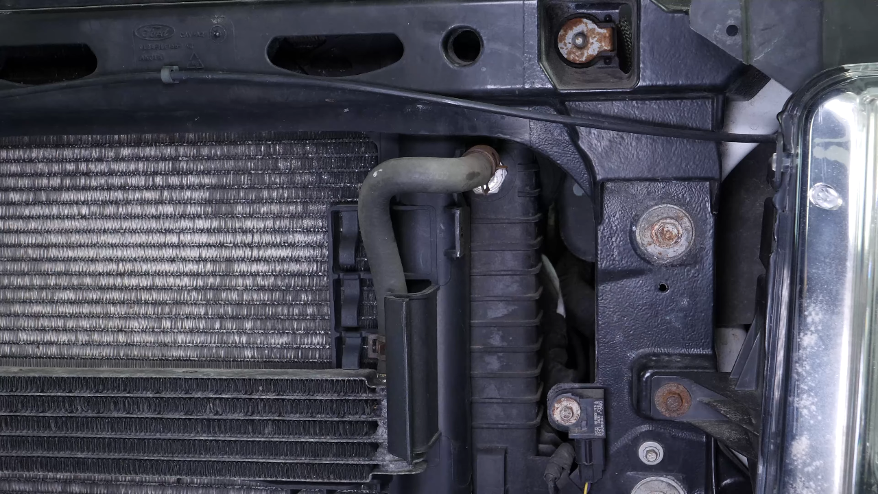 Unclip the air conditioning condenser from the radiator