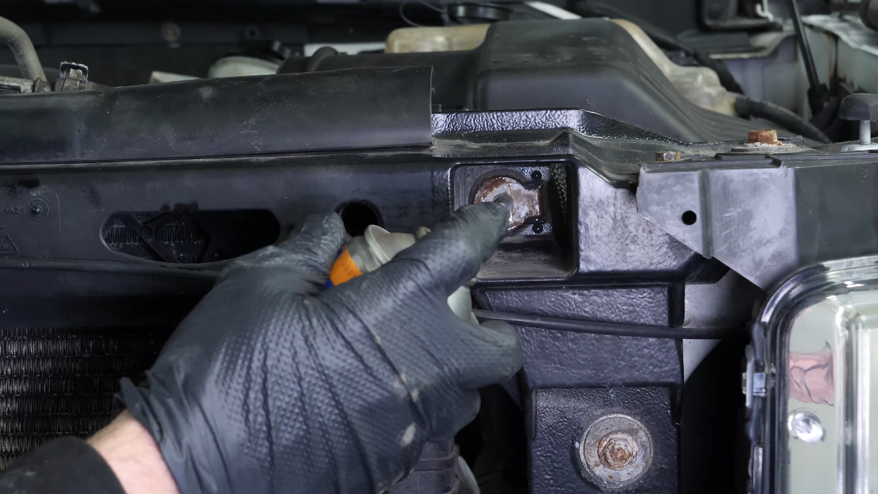 Unclip the air conditioning condenser from the radiator