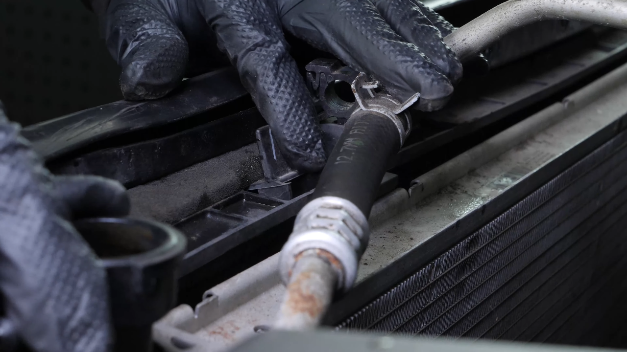 Unclip the air conditioning condenser from the radiator
