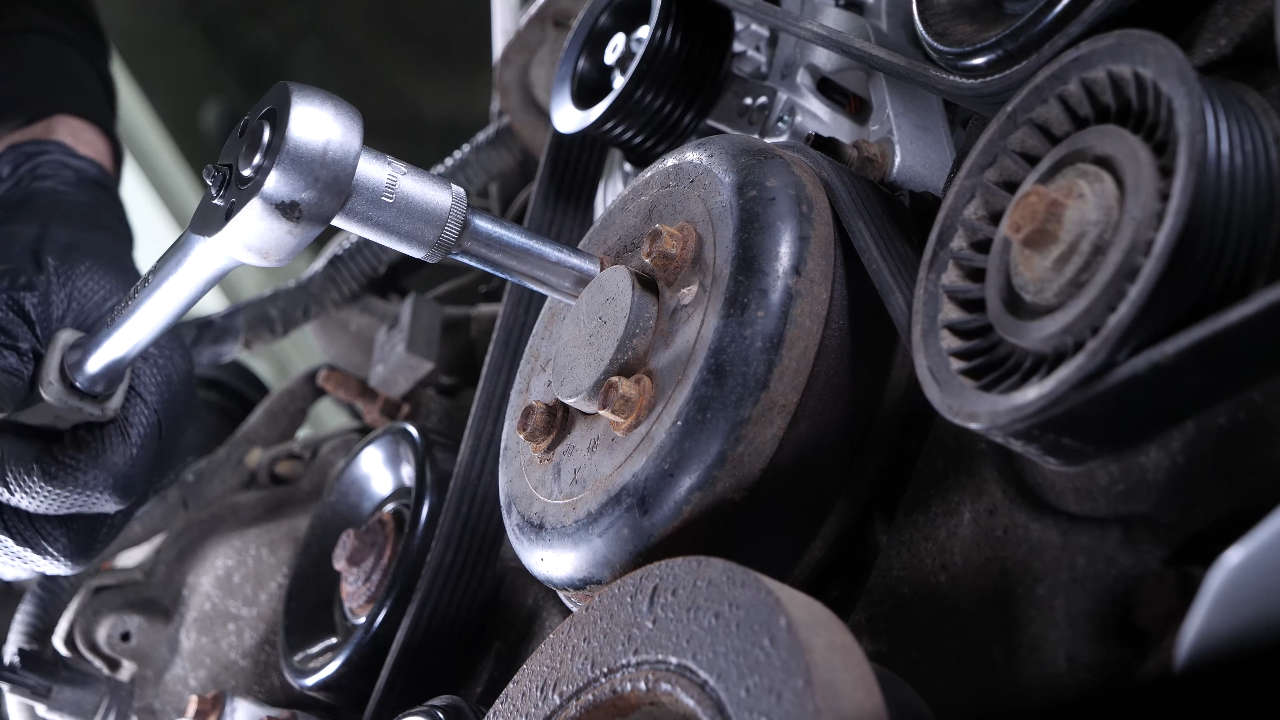 Loosen the water pump pulley bolts