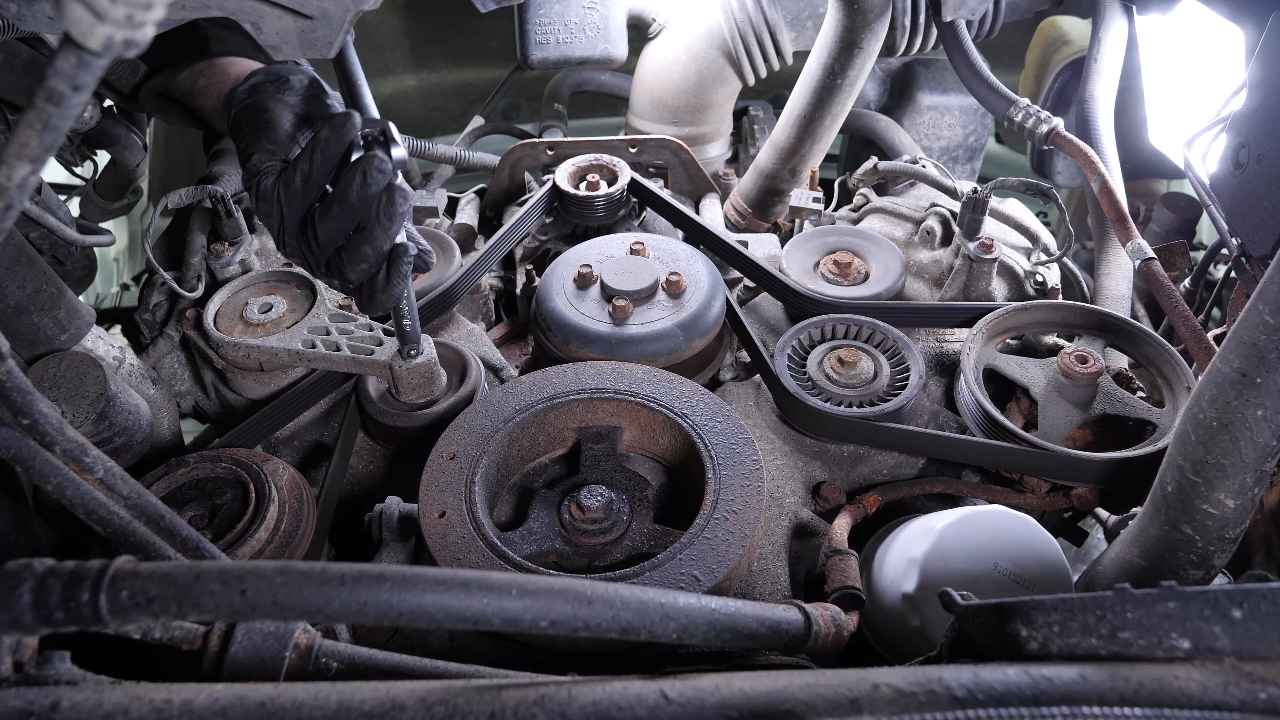Move the serpentine belt aside