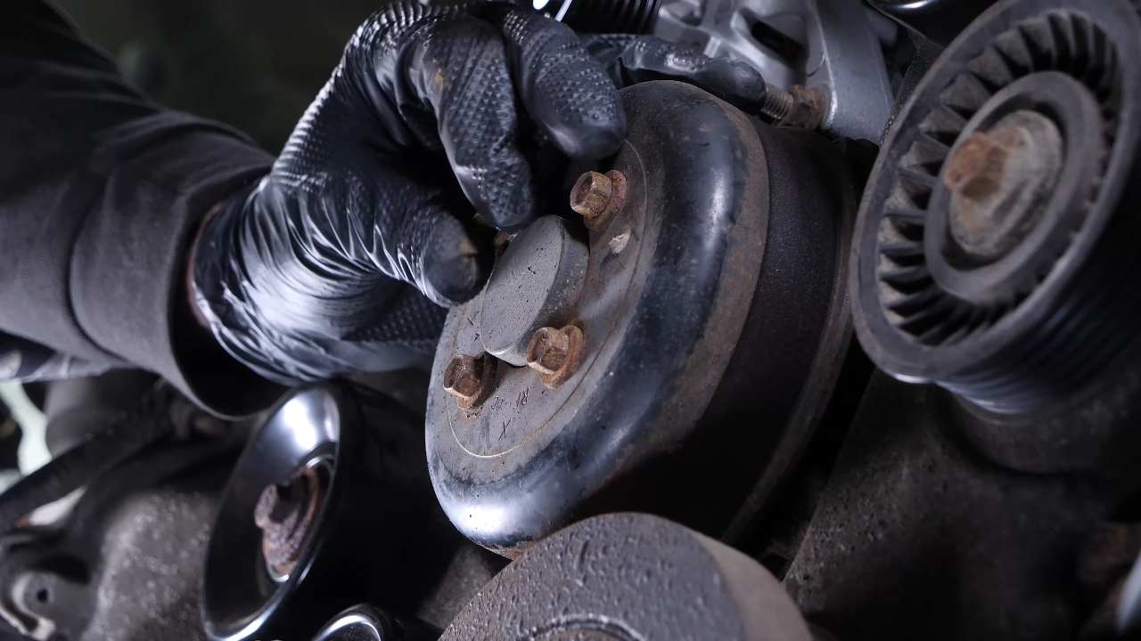 Move the serpentine belt aside