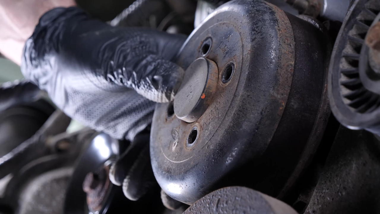 Move the serpentine belt aside
