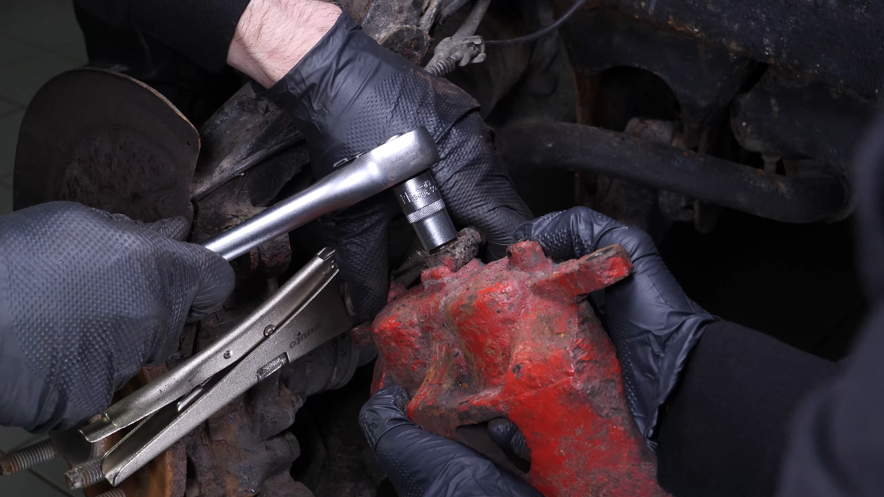 Remove the brake caliper