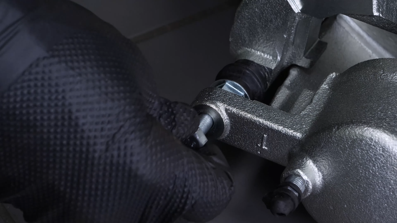 Put the new brake caliper back