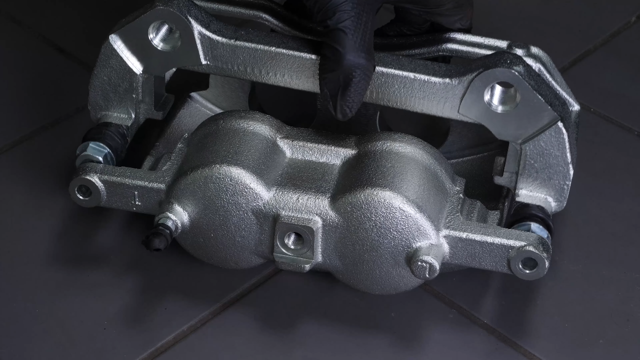 Put the new brake caliper back