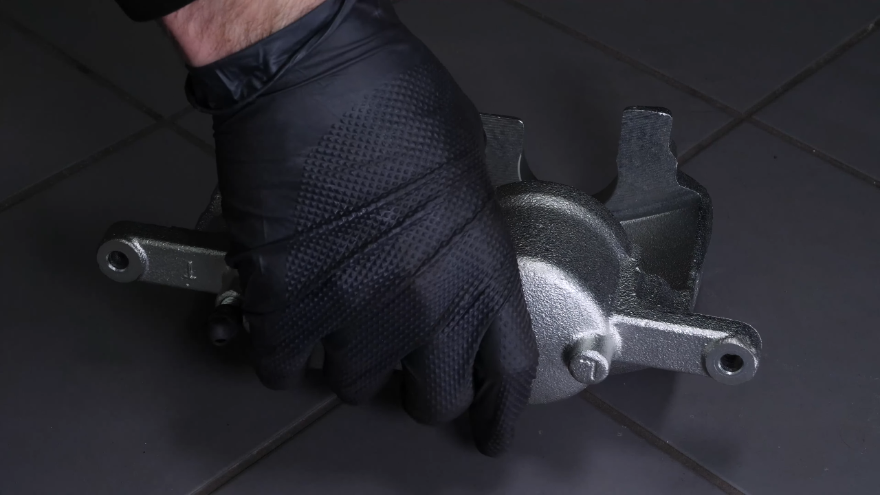 Put the new brake caliper back