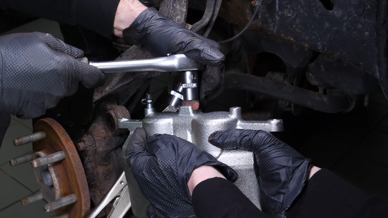 Put the new brake caliper back