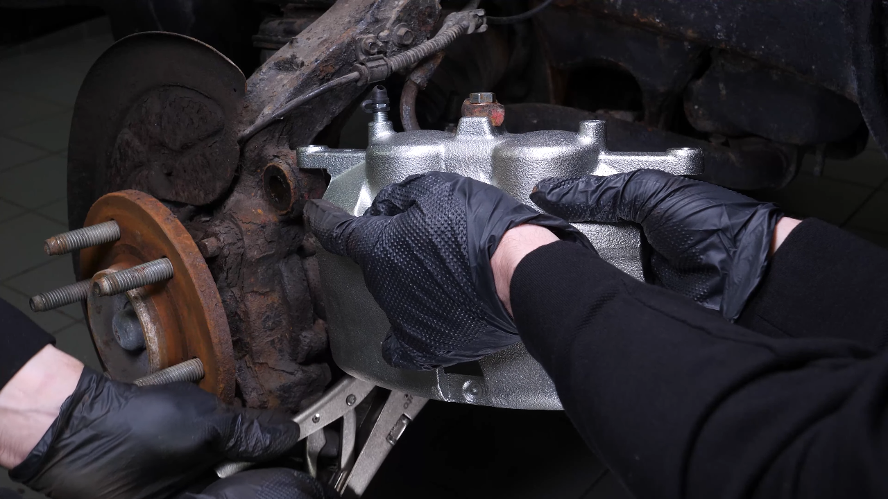 Put the new brake caliper back