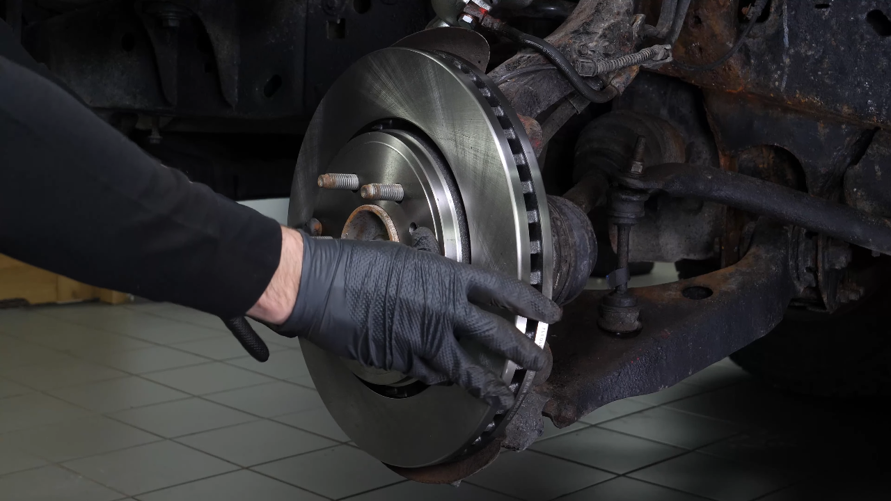 Put  the disc and pad assembly back