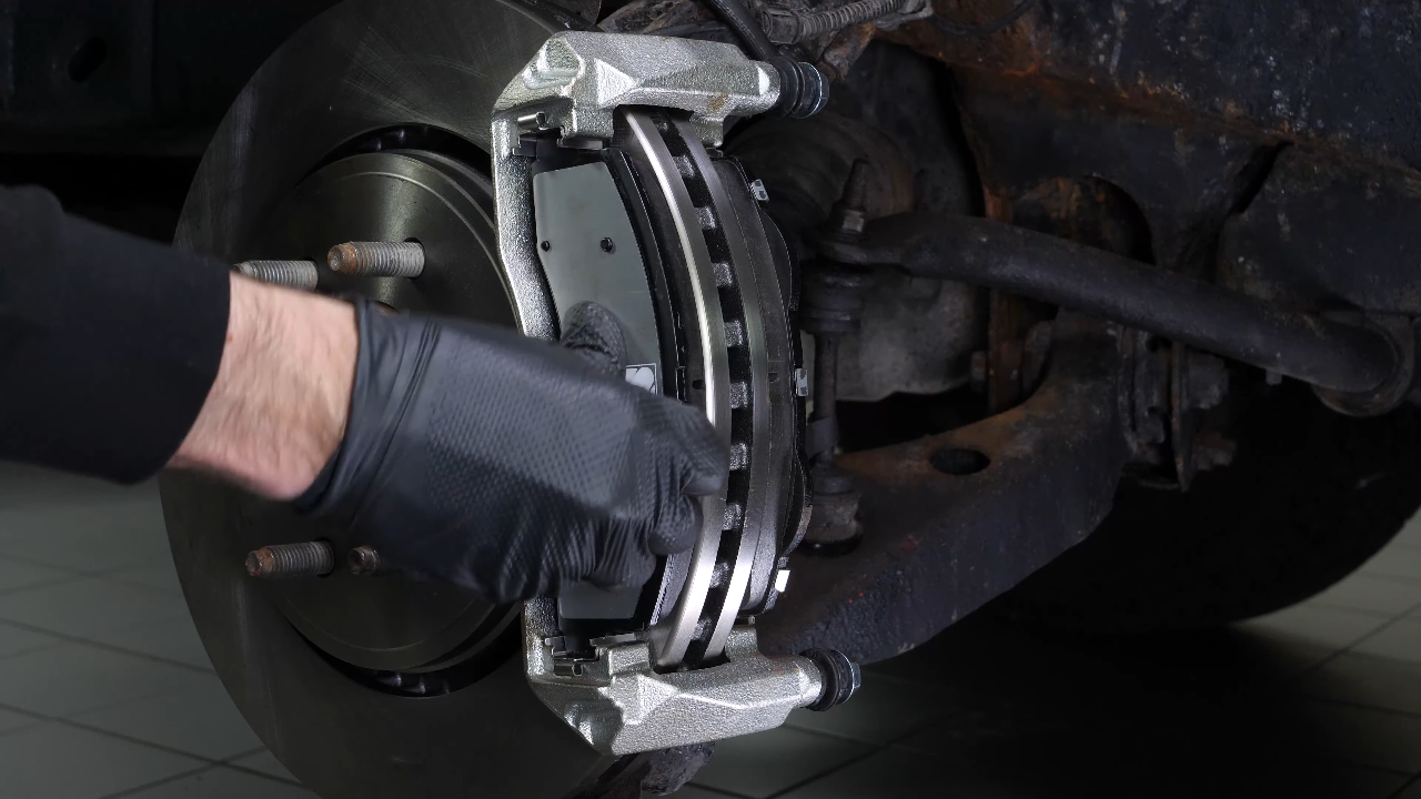 Put  the disc and pad assembly back