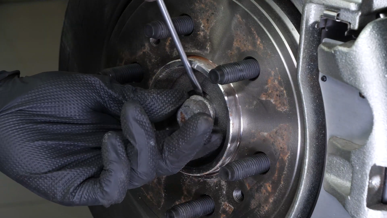 Unscrew the CV axle nut
