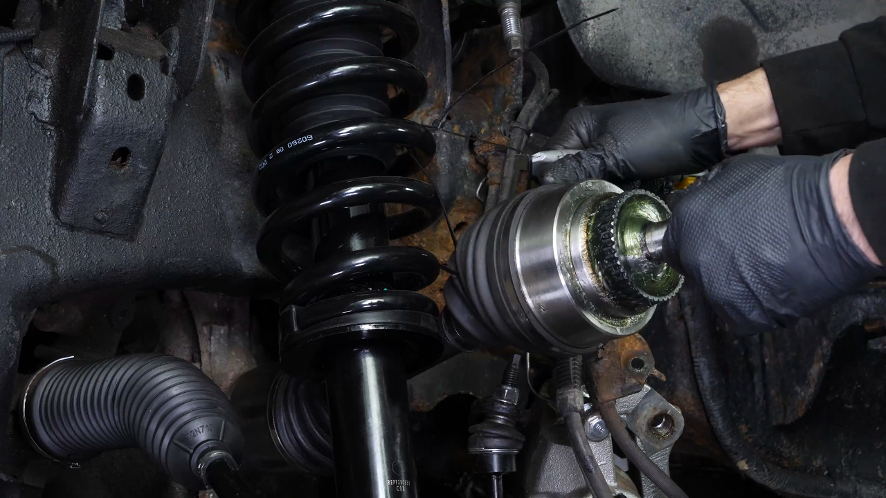 Screw the control arm ball joint nut back