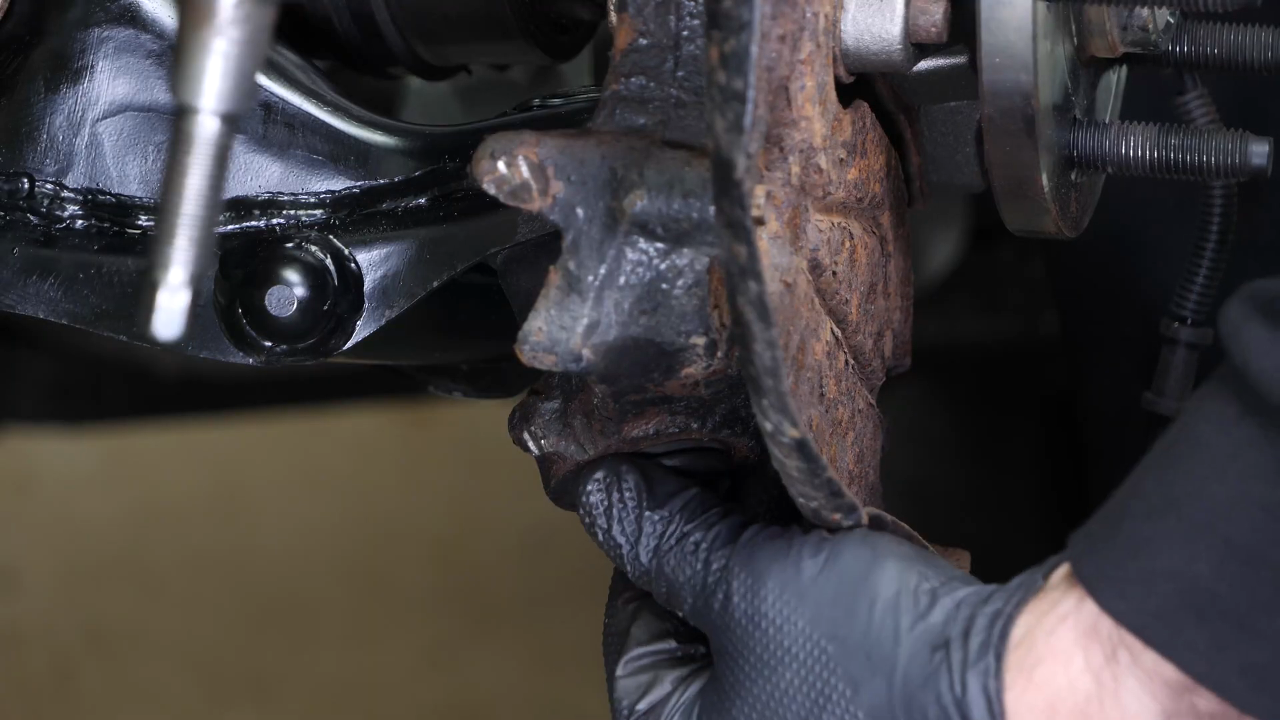 Screw the control arm ball joint nut back