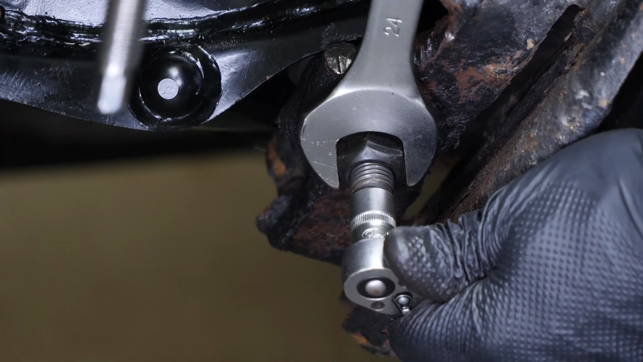 Screw the control arm ball joint nut back