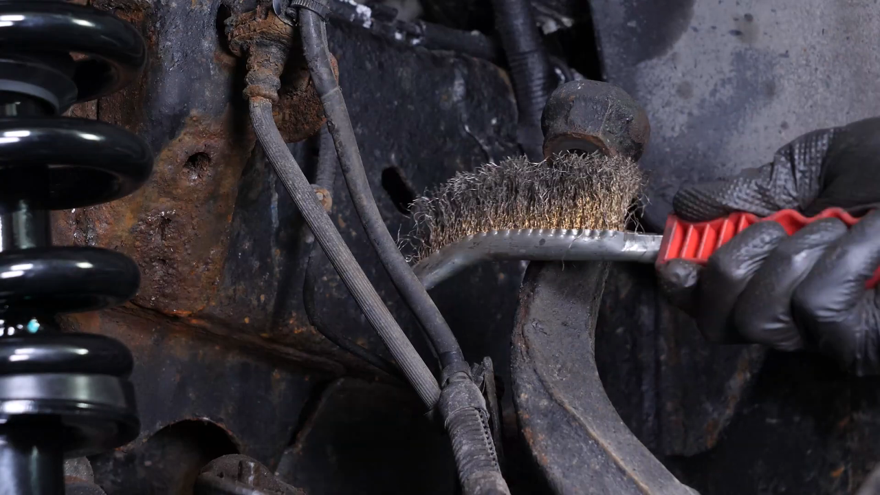 Screw the control arm ball joint nut back