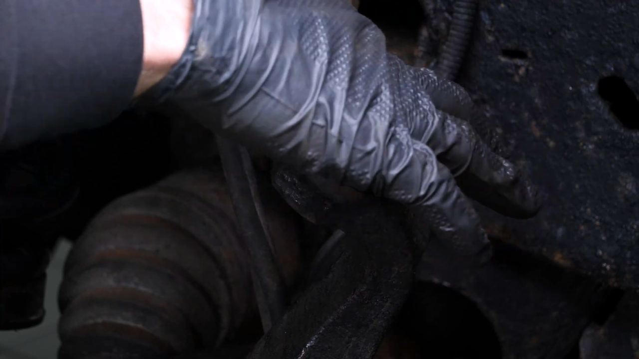 Screw the control arm ball joint nut back