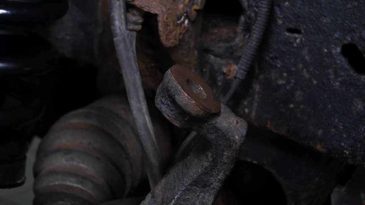 Screw the control arm ball joint nut back