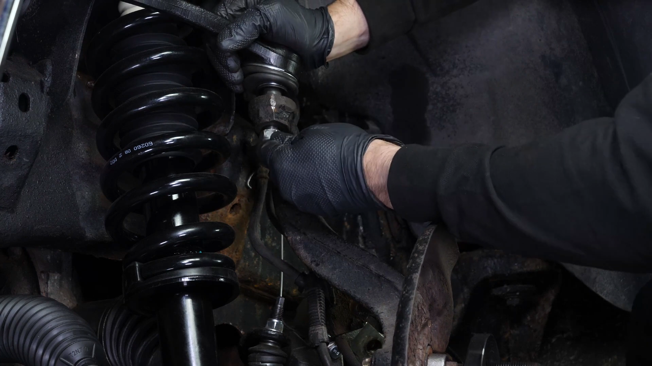 Screw the control arm ball joint nut back