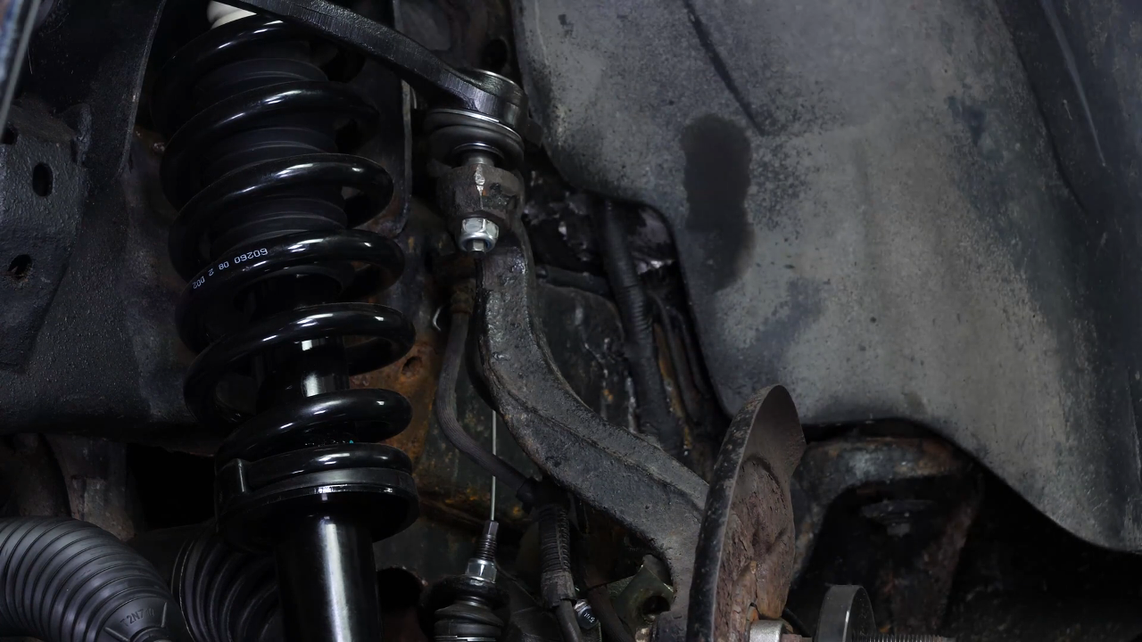 Screw the control arm ball joint nut back