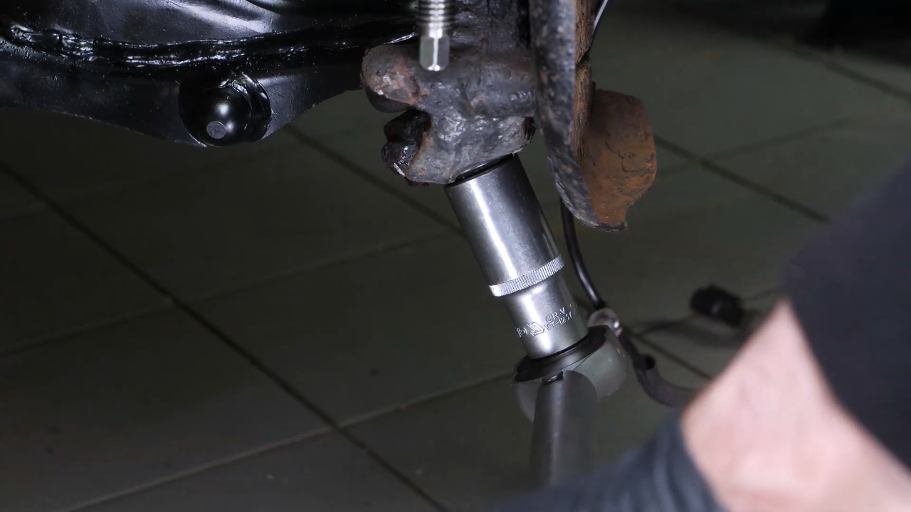 Put the outer tie rod back