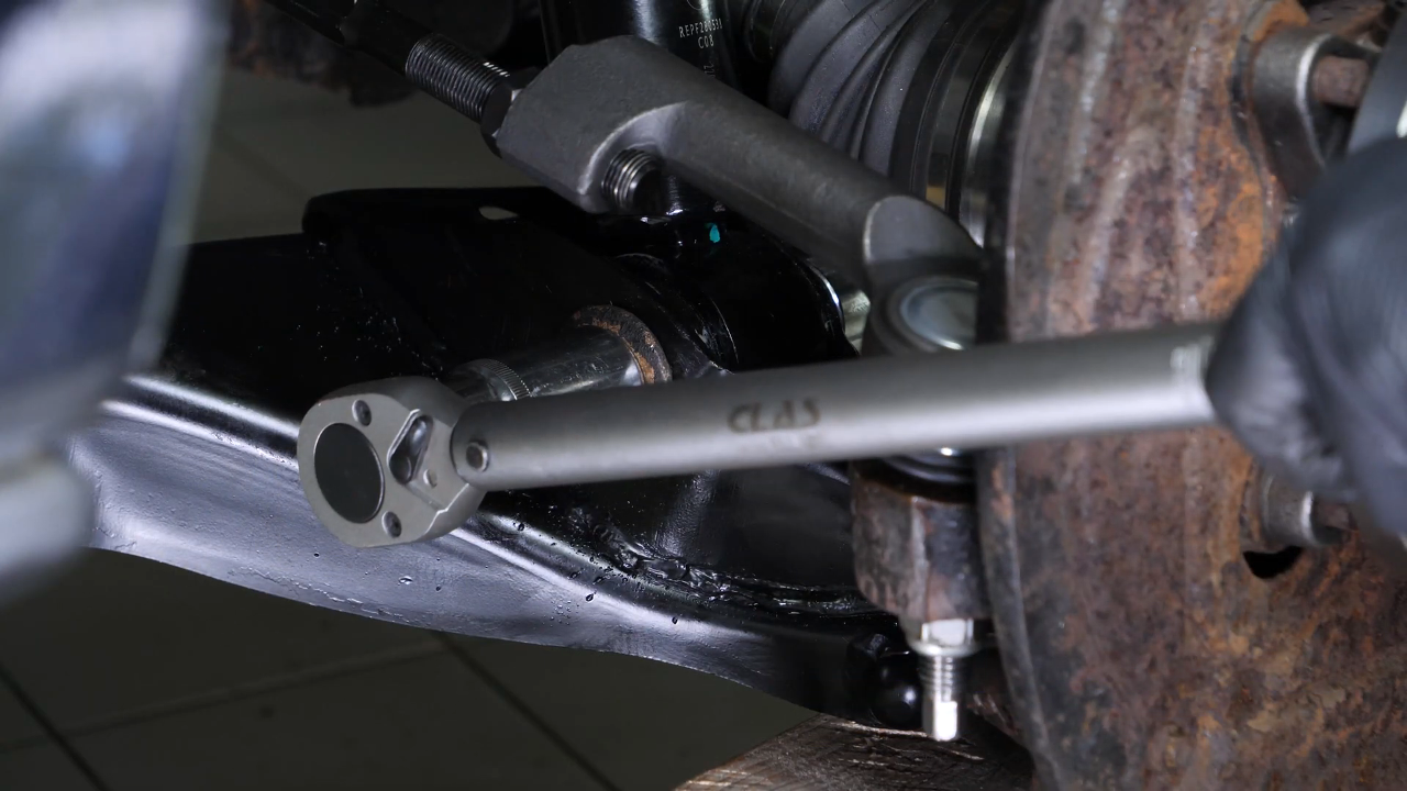 Put the outer tie rod back