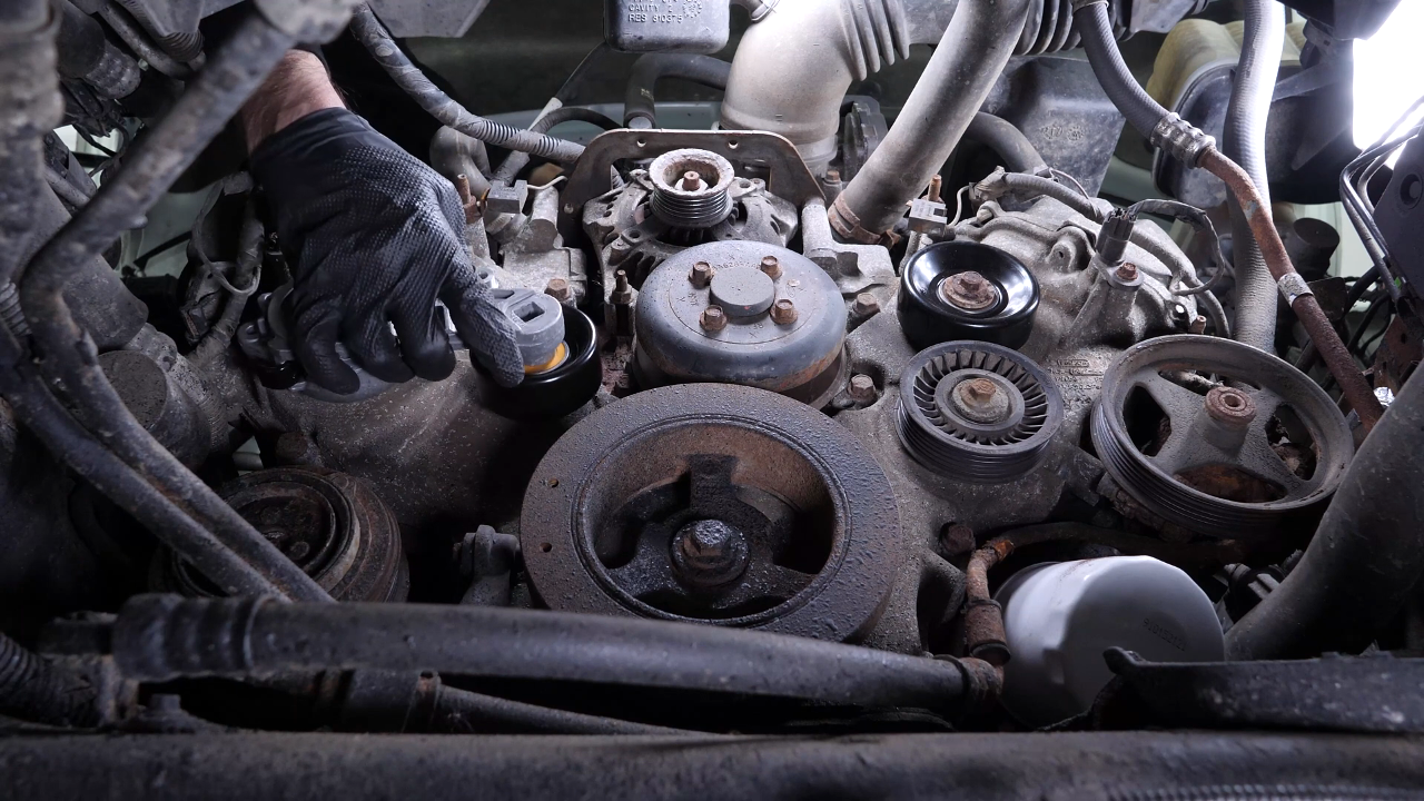 Install the new tensioner pulley