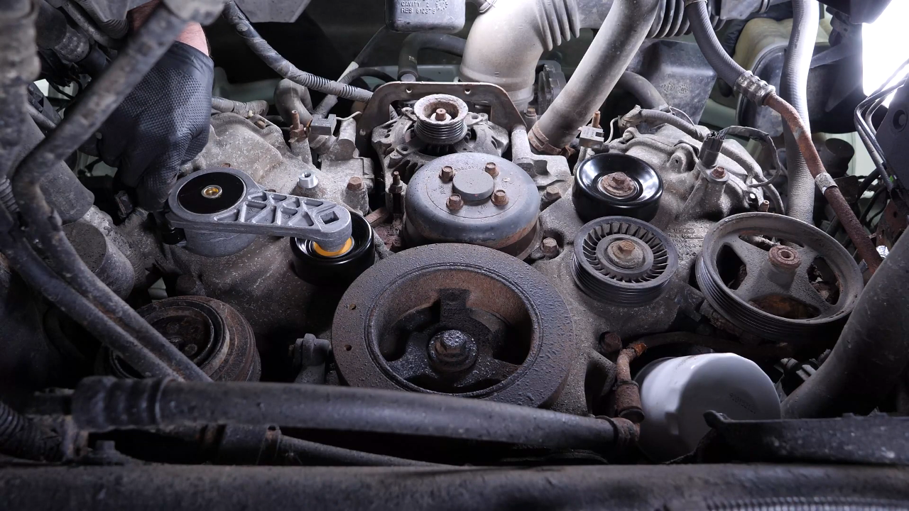 Install the new tensioner pulley