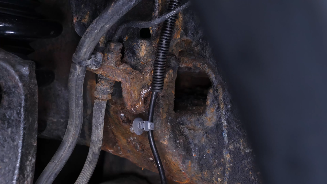 Disconnect the ABS and brake hose connectors