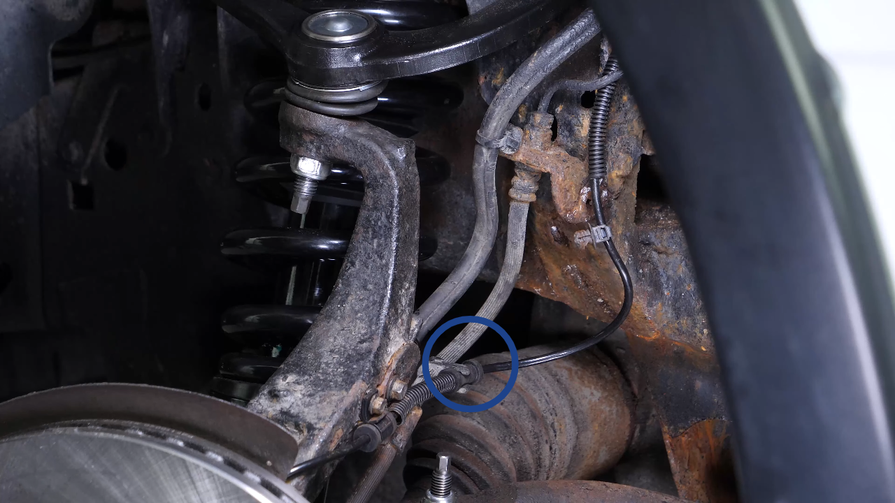 Disconnect the ABS and brake hose connectors
