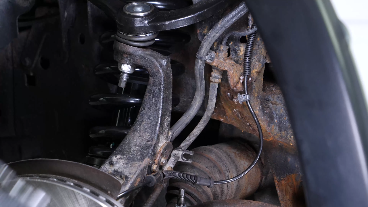 Disconnect the ABS and brake hose connectors