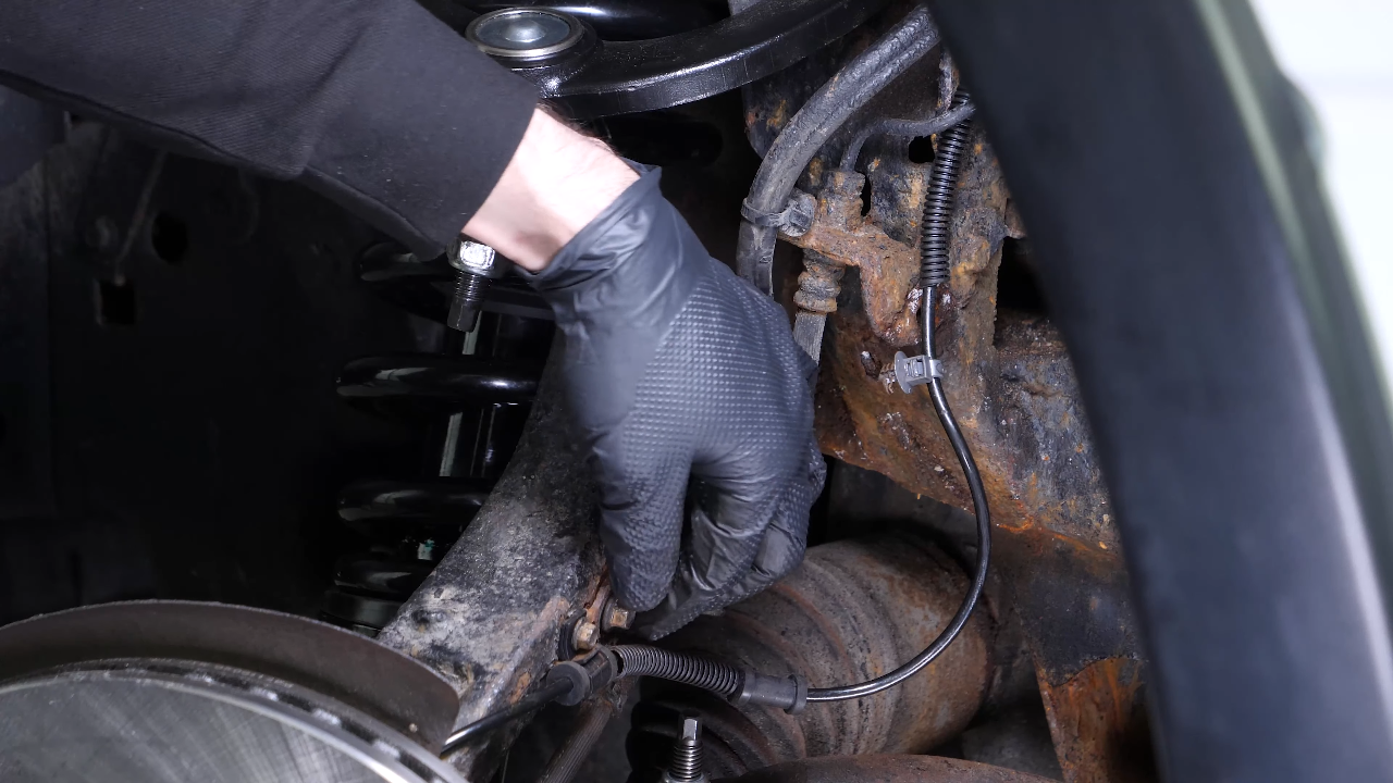 Disconnect the ABS and brake hose connectors