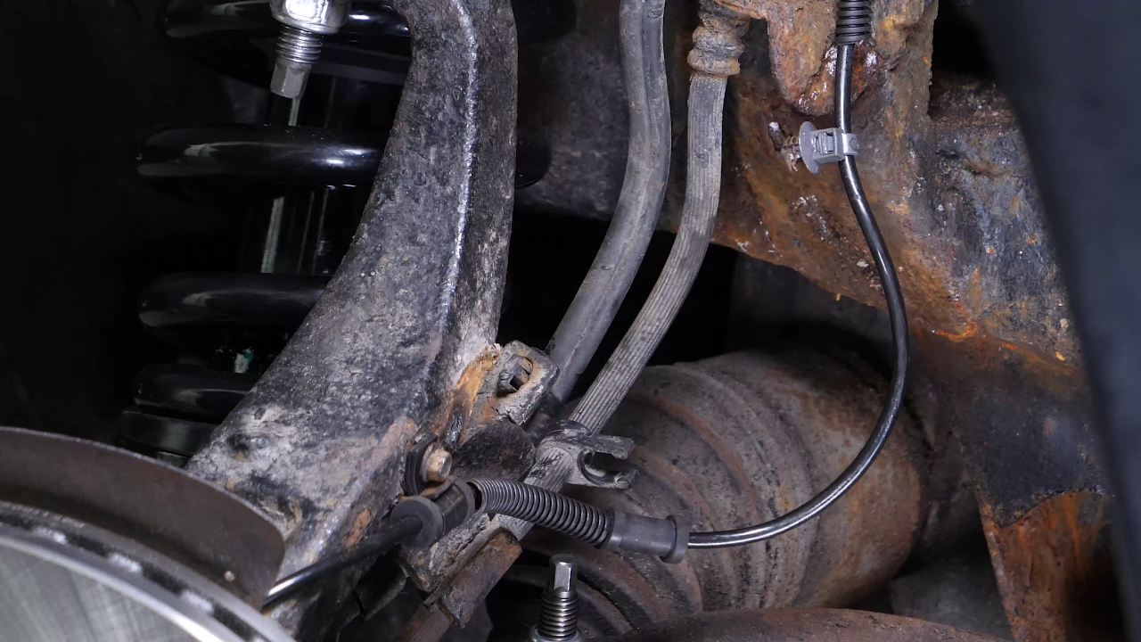 Disconnect the ABS and brake hose connectors