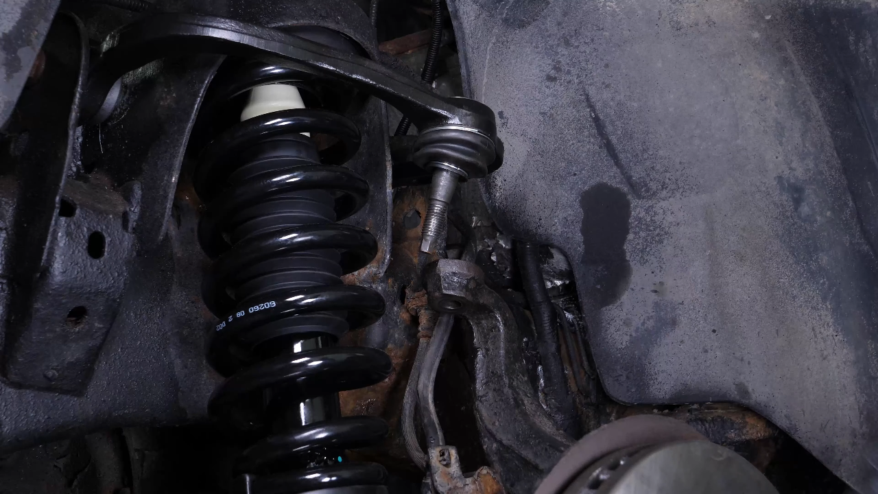 Screw the control arm ball joint nut back