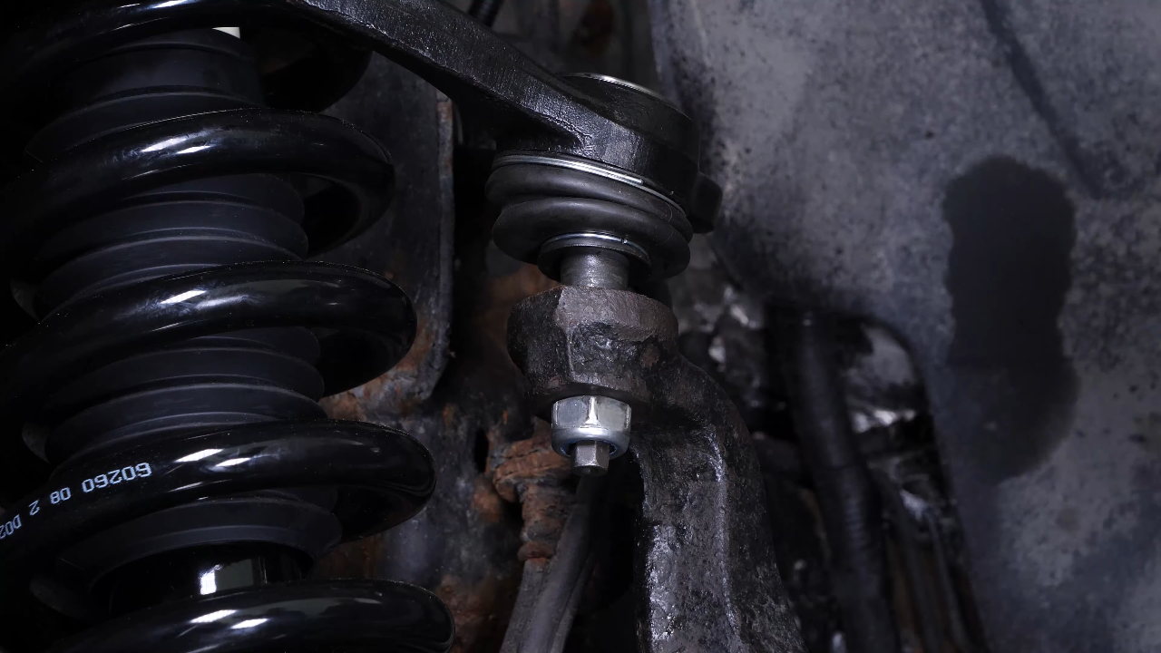 Screw the control arm ball joint nut back