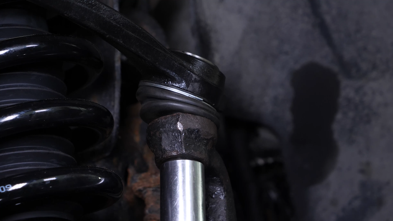 Screw the control arm ball joint nut back