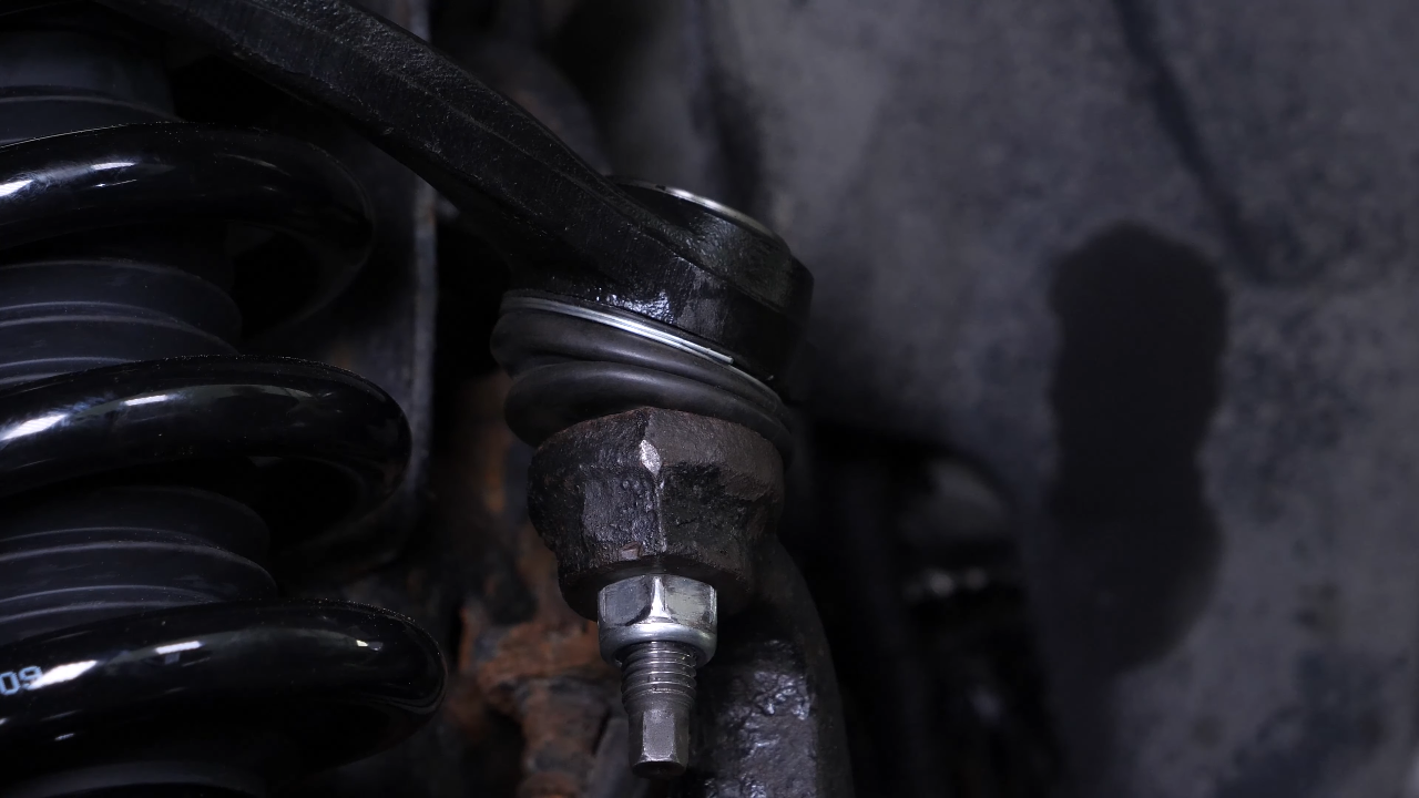 Screw the control arm ball joint nut back