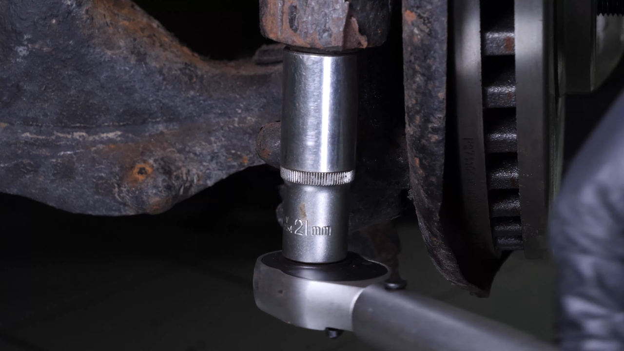 Screw the control arm ball joint nut back