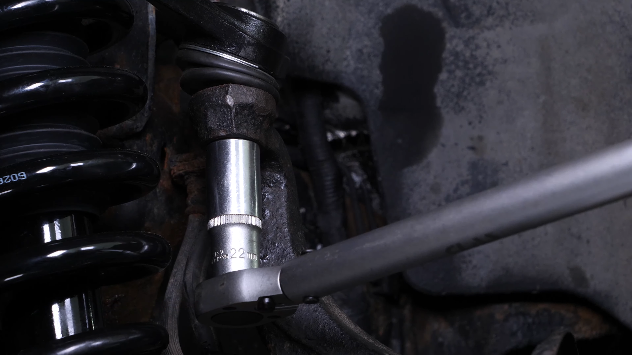 Screw the control arm ball joint nut back