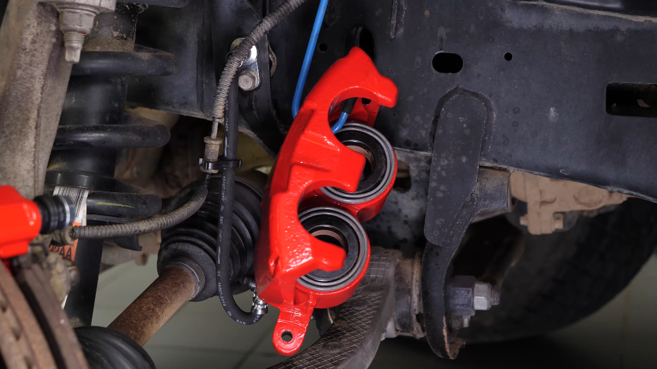 Remove the brake caliper