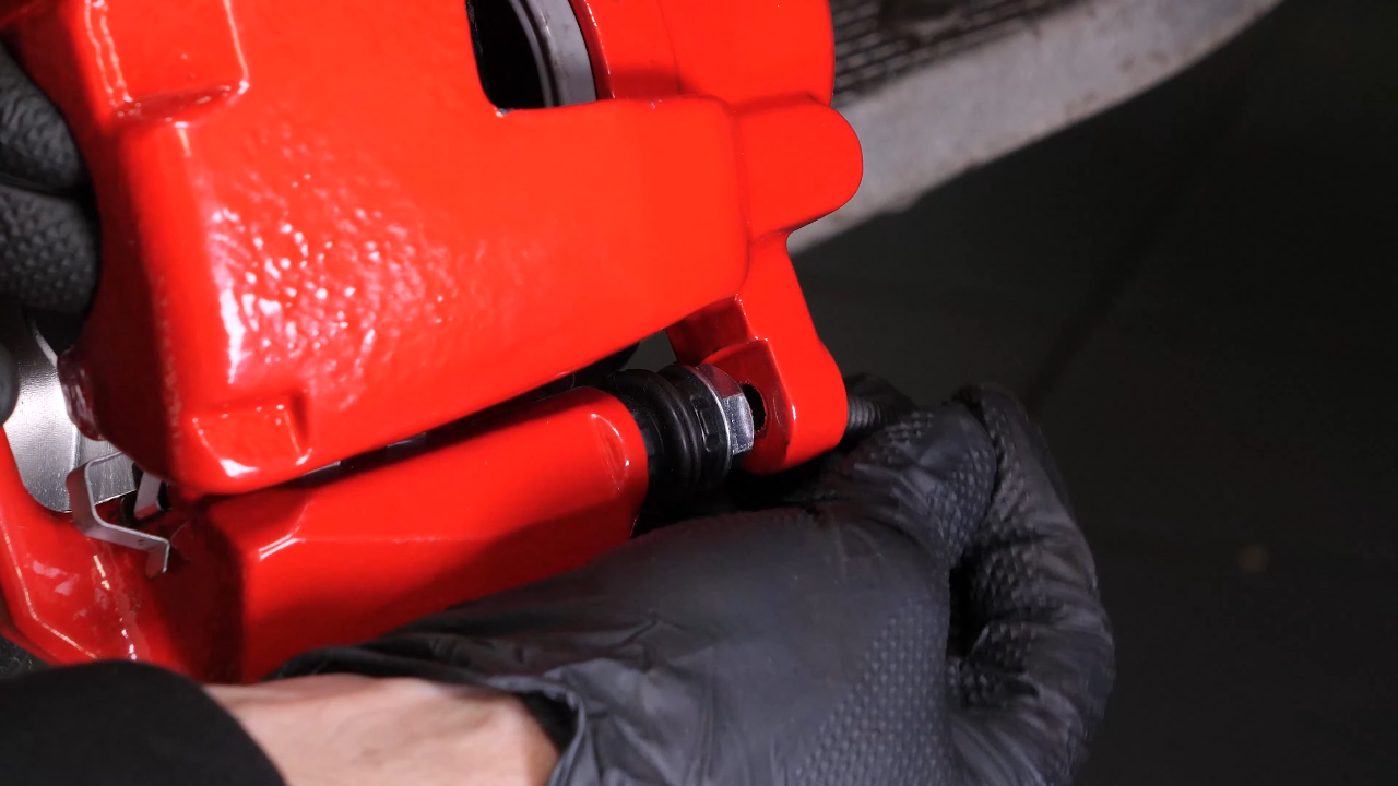 Put the brake caliper back