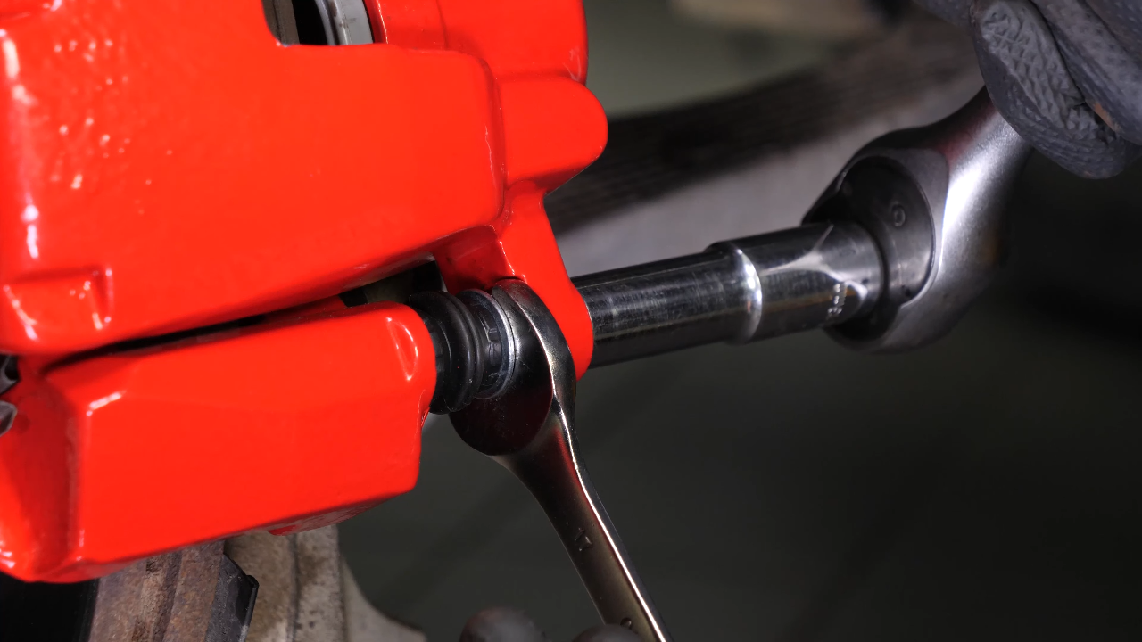 Remove the  brake caliper