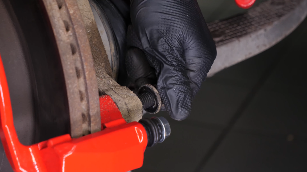 Remove the  brake caliper mount